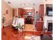 An inviting living room with hardwood floors, a fireplace, and an open floor plan to the kitchen at 805 Pleasant Hill Nw Rd # 343, Lilburn, GA 30047