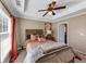 Inviting main bedroom with a tray ceiling, large window, and neutral decor at 805 Pleasant Hill Nw Rd # 343, Lilburn, GA 30047