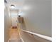 Stairway with hardwood floors and white railing, leading to the front door at 805 Pleasant Hill Nw Rd # 343, Lilburn, GA 30047