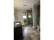 Bathroom featuring stylish tile flooring, a corner glass shower, and a gray accent wall at , Loganville, GA 30052