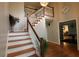 Grand foyer with staircase and hardwood floors, and modern decor at , Loganville, GA 30052