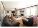 Spacious living room with hardwood floors, fireplace, ceiling fan, and wainscoting at , Loganville, GA 30052