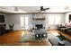 Bright living room features a decorative fireplace, hardwood floors, and a ceiling fan at , Loganville, GA 30052