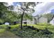 Spacious backyard featuring a wooden building and lush greenery, perfect for outdoor enjoyment at 3133 Callie Still Rd, Lawrenceville, GA 30045