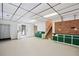 Spacious finished basement with a utility area, stairs, and access to the backyard, offering versatile space at 3133 Callie Still Rd, Lawrenceville, GA 30045