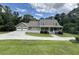 Charming home featuring a spacious front yard, two-car garage, and welcoming front porch at 3133 Callie Still Rd, Lawrenceville, GA 30045