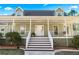 Inviting front porch with classic columns and ample space for relaxing and enjoying the outdoors at 3133 Callie Still Rd, Lawrenceville, GA 30045