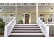 Welcoming front porch with white railings and a view of the entryway leading into the home at 3133 Callie Still Rd, Lawrenceville, GA 30045