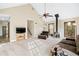Spacious living room with vaulted ceilings, a wood burning stove, and open staircase at 3133 Callie Still Rd, Lawrenceville, GA 30045