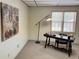Bright and well-lit home office with a decorative lamp, artwork, and a traditional-style desk, perfect for productivity at 3133 Callie Still Rd, Lawrenceville, GA 30045