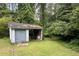 Outbuilding in backyard, suitable for storage or hobby space at 3133 Callie Still Rd, Lawrenceville, GA 30045