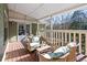Relaxing covered porch with wicker furniture perfect for enjoying the outdoors at 3133 Callie Still Rd, Lawrenceville, GA 30045