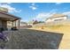 Expansive backyard with a covered patio, ideal for entertaining and outdoor activities at 3823 Dragon Fly Ln, Loganville, GA 30052