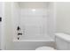 Bathroom with a white tub/shower combination and matching toilet at 3823 Dragon Fly Ln, Loganville, GA 30052