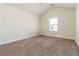 Cozy bedroom with a vaulted ceiling and a bright window view at 3823 Dragon Fly Ln, Loganville, GA 30052