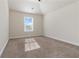 Bright bedroom with vaulted ceilings, carpet, and a sunny window at 3823 Dragon Fly Ln, Loganville, GA 30052