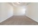 Bedroom features tray ceilings, carpet, and a single window at 3823 Dragon Fly Ln, Loganville, GA 30052
