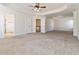 Spacious bonus room featuring tray ceilings and multiple entryways at 3823 Dragon Fly Ln, Loganville, GA 30052