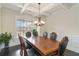 Formal dining room with hardwood floors, wainscoting, and a chandelier at 3823 Dragon Fly Ln, Loganville, GA 30052