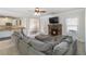 Cozy living room with stone fireplace and an open concept to the kitchen with granite countertops at 3823 Dragon Fly Ln, Loganville, GA 30052