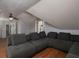 Attic living room with hardwood floors, fan, and comfortable couch at 517 Sheritan Sw Way, Smyrna, GA 30082