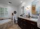 Bathroom with soaking tub, granite vanity, and elegant dark wood cabinets at 517 Sheritan Sw Way, Smyrna, GA 30082
