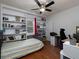 Bedroom with bed, study desk, and built-in white shelving at 517 Sheritan Sw Way, Smyrna, GA 30082