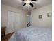 Bedroom with a closet, ceiling fan, and view of staircase at 517 Sheritan Sw Way, Smyrna, GA 30082