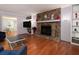 Living room with hardwood floors, stone fireplace and built-in shelving at 517 Sheritan Sw Way, Smyrna, GA 30082