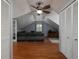 Cozy attic living room with hardwood floors and comfortable seating at 517 Sheritan Sw Way, Smyrna, GA 30082