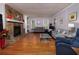 Spacious living room with stone fireplace, hardwood floors and neutral paint at 517 Sheritan Sw Way, Smyrna, GA 30082
