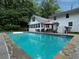 Backyard features an in-ground pool surrounded by mature trees at 517 Sheritan Sw Way, Smyrna, GA 30082