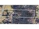 Aerial view of a 5-acre property with 3.5 acres of woods and trails, outlined in white at 2452 Camp Mitchell Rd, Grayson, GA 30017