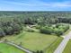 Expansive property featuring a home, fenced pasture, and lush greenery creating a serene, private estate at 2452 Camp Mitchell Rd, Grayson, GA 30017