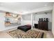 Basement bedroom area with black bed and dark accents at 2452 Camp Mitchell Rd, Grayson, GA 30017