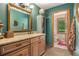 Elegant bathroom featuring a granite countertop, wooden cabinets, and vintage-style decor at 2452 Camp Mitchell Rd, Grayson, GA 30017