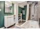 Modern bathroom features a sleek vanity, stylish tile work, and a shower-tub combination, offering a spa-like experience at 2452 Camp Mitchell Rd, Grayson, GA 30017