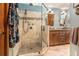 Elegant bathroom featuring a glass-enclosed shower and a vanity with double sinks at 2452 Camp Mitchell Rd, Grayson, GA 30017