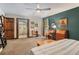 Spacious bedroom with a bathroom and balcony access at 2452 Camp Mitchell Rd, Grayson, GA 30017