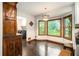 Bright dining area with a bay window offering natural light and backyard views at 2452 Camp Mitchell Rd, Grayson, GA 30017