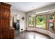 A well-lit dining area with hardwood floors and views of the outdoors at 2452 Camp Mitchell Rd, Grayson, GA 30017