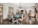 Open-concept dining area with views of the living room, kitchen, and stylish furnishings at 2452 Camp Mitchell Rd, Grayson, GA 30017