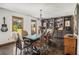 Dining area with a unique table setting, dark wood floors, and built in shelving at 2452 Camp Mitchell Rd, Grayson, GA 30017