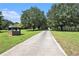 Tree-lined driveway leading to a country estate with plenty of privacy at 2452 Camp Mitchell Rd, Grayson, GA 30017