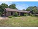 Stunning exterior view with brick, a well-manicured lawn, and mature plantings at 2452 Camp Mitchell Rd, Grayson, GA 30017