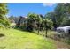 View of the property featuring a grassy yard and an Airstream trailer on the grounds at 2452 Camp Mitchell Rd, Grayson, GA 30017