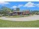 Beautiful home featuring a large driveway, outdoor seating area, and mature landscaping for serene outdoor living at 2452 Camp Mitchell Rd, Grayson, GA 30017