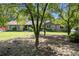 Ranch home with mature landscaping, large lawn and tree-lined backyard at 2452 Camp Mitchell Rd, Grayson, GA 30017