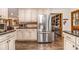 Modern kitchen featuring stainless steel appliances, granite countertops, and custom cabinets at 2452 Camp Mitchell Rd, Grayson, GA 30017
