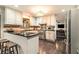 Kitchen bar with stainless appliances, wooden countertop and island stools at 2452 Camp Mitchell Rd, Grayson, GA 30017